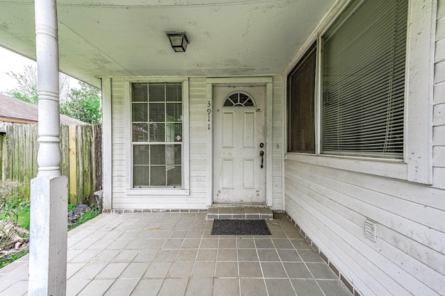 doorway to property featuring covered porch