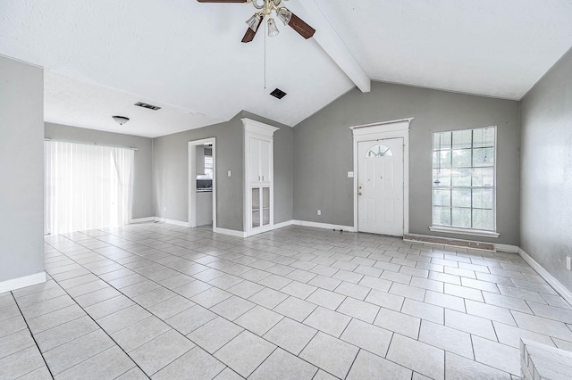unfurnished living room featuring a ceiling fan, light tile patterned floors, and baseboards