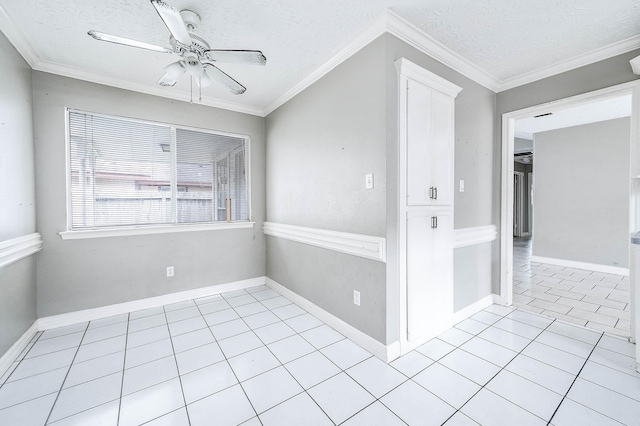 unfurnished room with light tile patterned flooring, ceiling fan, a textured ceiling, and ornamental molding