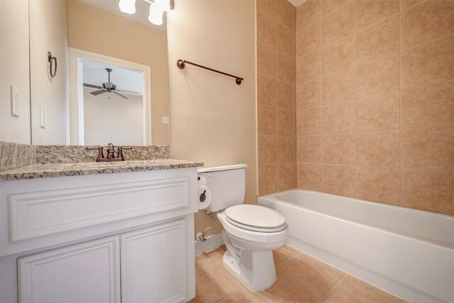 full bathroom featuring toilet, ceiling fan, vanity, tile patterned floors, and shower / bathtub combination