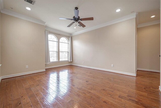 empty room featuring a ceiling fan, wood finished floors, baseboards, recessed lighting, and ornamental molding