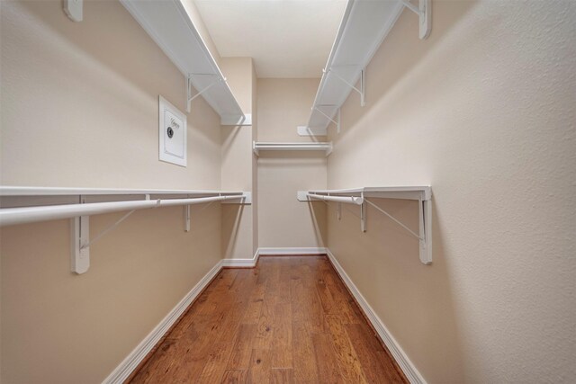 spacious closet with wood finished floors