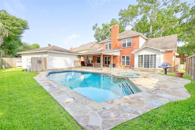 4010 Haven Pines Dr, Houston, TX 77345 - view of swimming pool featuring a patio area, a pool with connected hot tub, and grilling area