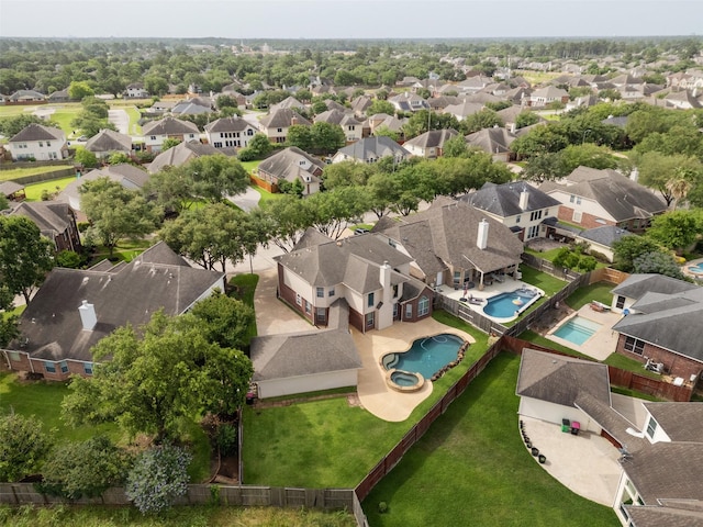 aerial view of residential area with a pool area