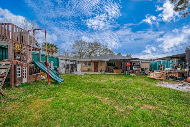 11104 Timber Crest Dr, Houston, TX 77065 - rear view of property featuring a playground, a yard, and a patio area