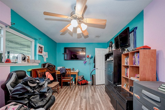 11104 Timber Crest Dr, Houston, TX 77065 - recreation room with wood finished floors and ceiling fan