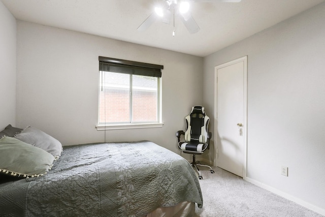 bedroom with carpet, baseboards, and a ceiling fan