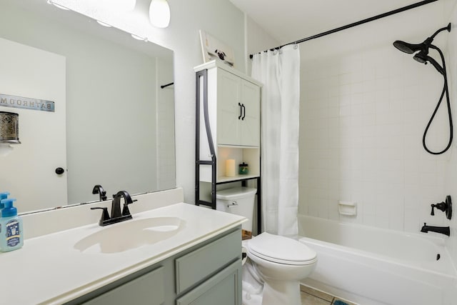 bathroom with toilet, shower / tub combo, vanity, and tile patterned floors