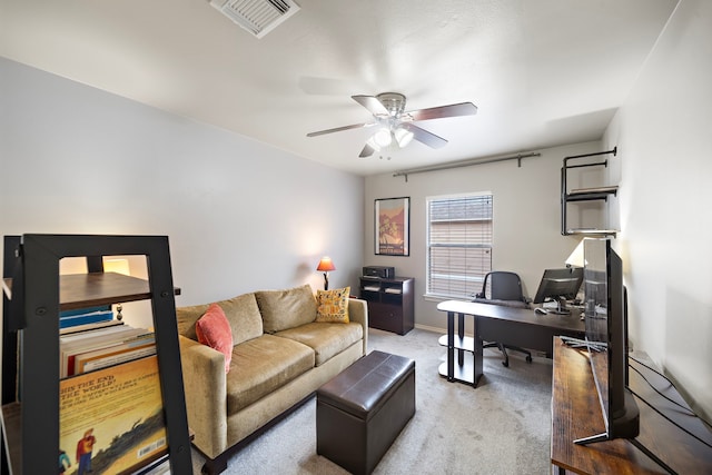 office with a ceiling fan, carpet flooring, and baseboards