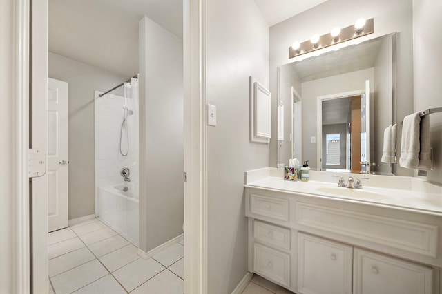 full bath with tile patterned flooring, vanity, baseboards, and shower / tub combo with curtain