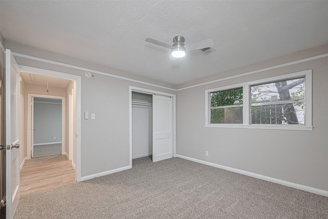 7702 Darnay Dr, Houston, TX 77033 - unfurnished bedroom with attic access, light carpet, a closet, baseboards, and a textured ceiling