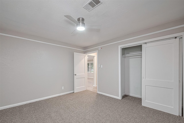 7702 Darnay Dr, Houston, TX 77033 - unfurnished bedroom with light carpet, baseboards, a textured ceiling, a closet, and a ceiling fan