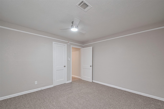 7702 Darnay Dr, Houston, TX 77033 - unfurnished room featuring a ceiling fan, carpet, a textured ceiling, and baseboards