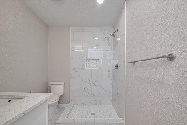 7702 Darnay Dr, Houston, TX 77033 - bathroom featuring toilet, marble finish flooring, vanity, a textured wall, and a tile shower
