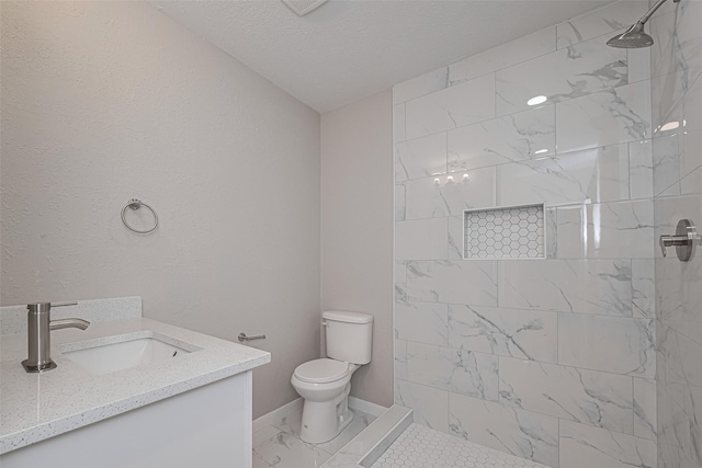 7702 Darnay Dr, Houston, TX 77033 - full bathroom with toilet, tiled shower, vanity, a textured ceiling, and marble finish floors