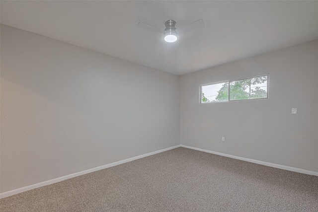 7702 Darnay Dr, Houston, TX 77033 - empty room featuring ceiling fan, carpet floors, and baseboards