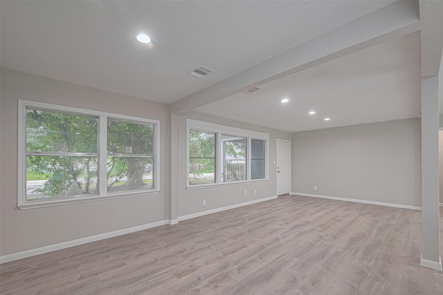 7702 Darnay Dr, Houston, TX 77033 - unfurnished room with light wood-style floors, baseboards, and recessed lighting