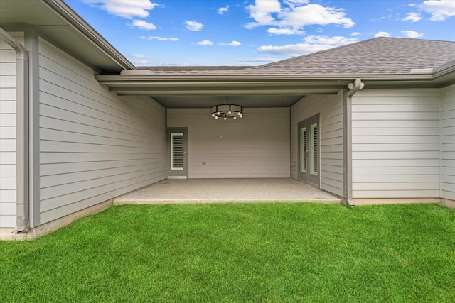 929 Oak St, Houston, TX 77018 - property entrance featuring a yard, a shingled roof, and a patio