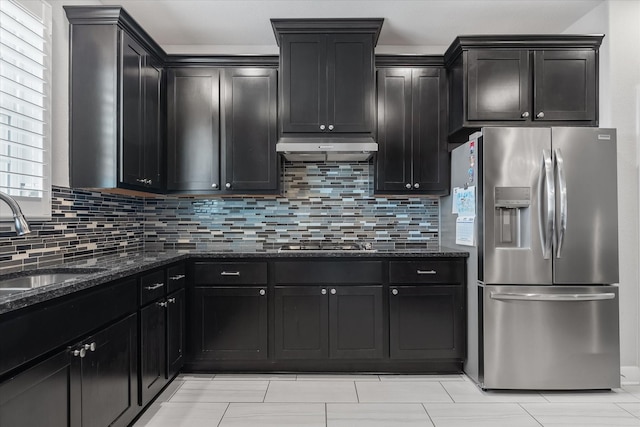 929 Oak St, Houston, TX 77018 - kitchen featuring stainless steel appliances, dark stone counters, a sink, and decorative backsplash