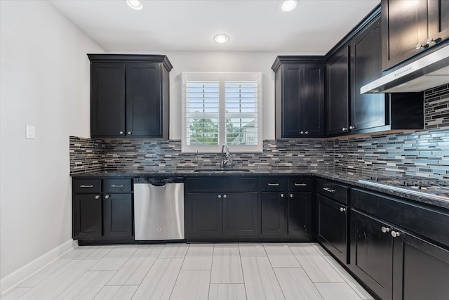 929 Oak St, Houston, TX 77018 - kitchen with stainless steel appliances, a sink, decorative backsplash, dark stone counters, and recessed lighting