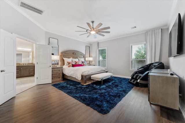 929 Oak St, Houston, TX 77018 - bedroom featuring wood finished floors, ornamental molding, ensuite bathroom, a ceiling fan, and baseboards
