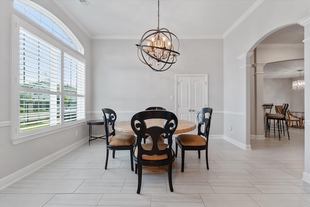 929 Oak St, Houston, TX 77018 - dining area featuring a chandelier, ornate columns, arched walkways, plenty of natural light, and ornamental molding