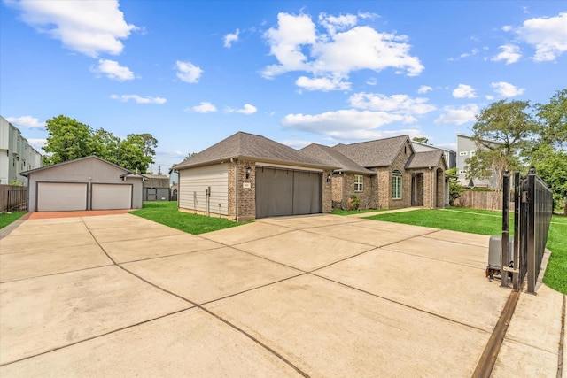 929 Oak St, Houston, TX 77018 - view of front of property with brick siding, a shingled roof, and a detached garage