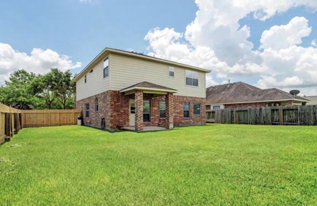 back of property featuring brick siding