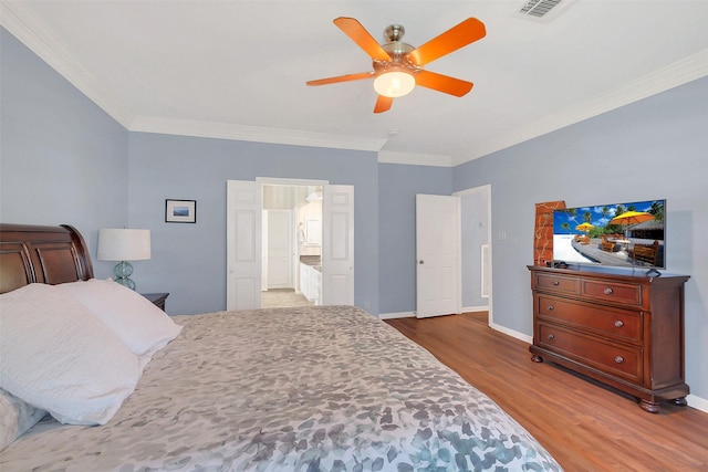 bedroom featuring wood finished floors, crown molding, baseboards, and a ceiling fan