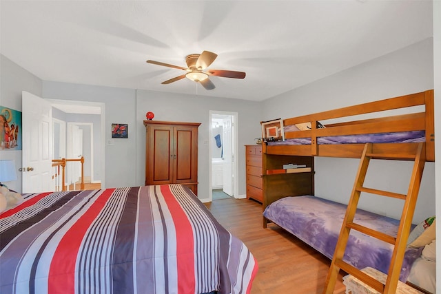 bedroom with wood finished floors and baseboards