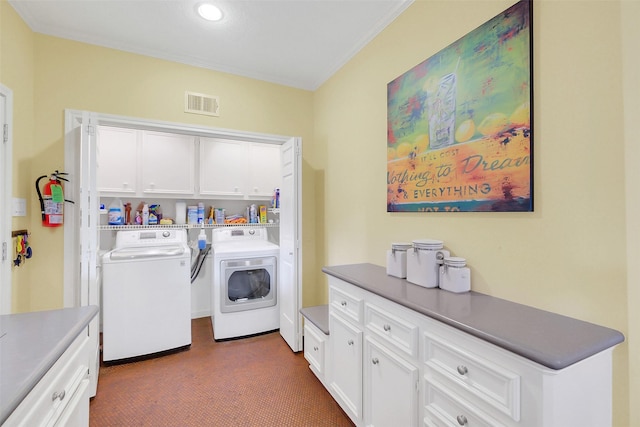washroom with separate washer and dryer, cabinet space, ornamental molding, and recessed lighting