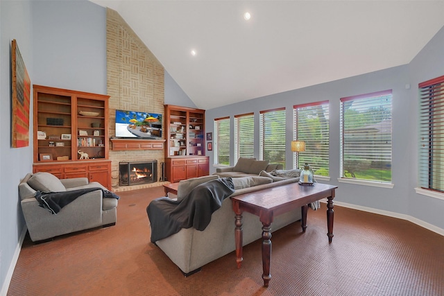carpeted living room with high vaulted ceiling, a fireplace, baseboards, and healthy amount of natural light
