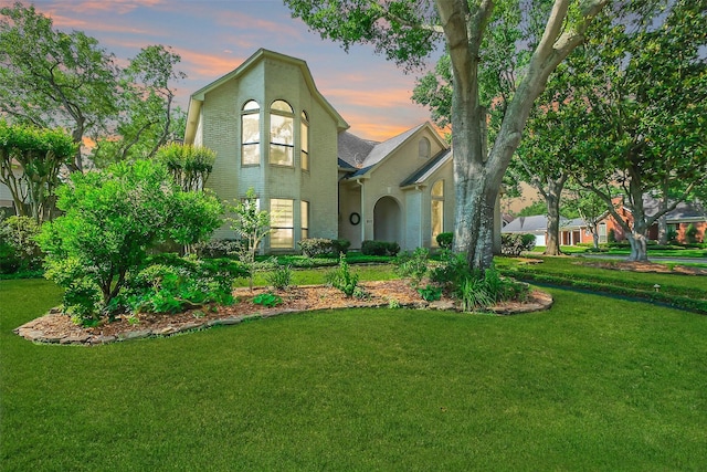 view of front of house with a yard