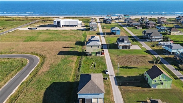 aerial view of residential area featuring a large body of water