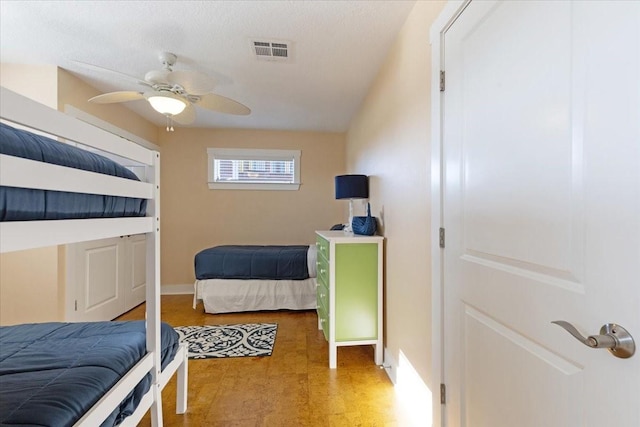 bedroom featuring baseboards and a ceiling fan