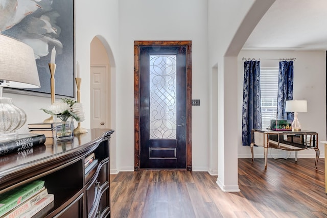 81 San Simeon Dr, Manvel, TX 77578 - entryway with arched walkways, wood finished floors, and baseboards