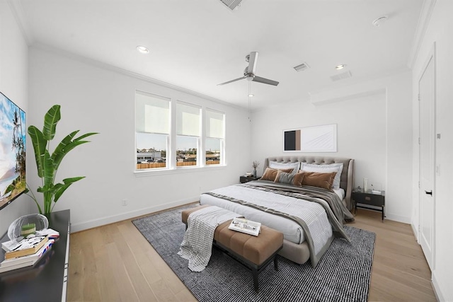 bedroom with ornamental molding, recessed lighting, light wood-style flooring, baseboards, and a ceiling fan