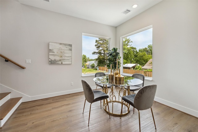 524 Janisch Rd, Houston, TX 77018 - dining space featuring baseboards, stairs, wood finished floors, and recessed lighting