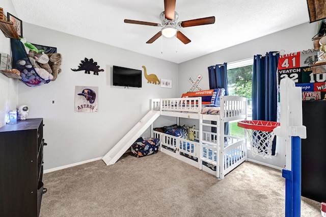 carpeted bedroom featuring baseboards