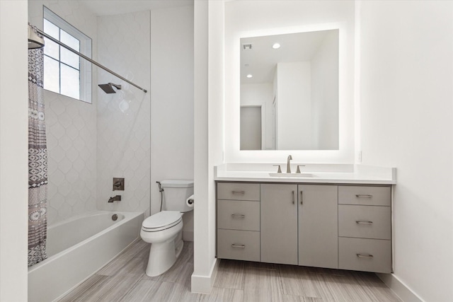 bathroom featuring toilet, baseboards, vanity, shower / bath combination with curtain, and wood finished floors