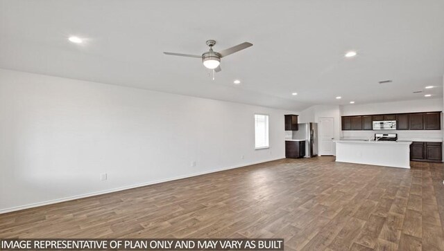 14819 Crimson Peak Ln, Splendora, TX 77372 - unfurnished living room featuring wood finished floors, recessed lighting, a ceiling fan, and baseboards