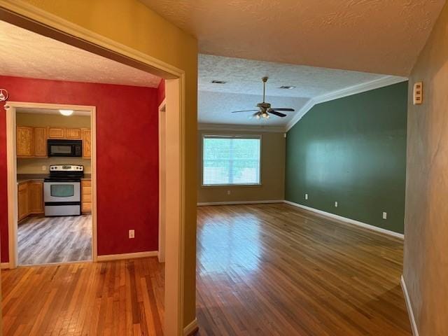 10826 Buffum St, Houston, TX 77051 - unfurnished living room with a textured ceiling, wood finished floors, ceiling fan, baseboards, and crown molding