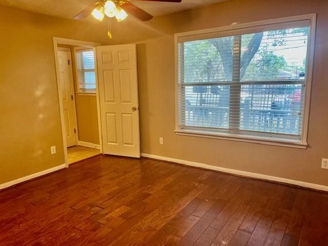 10826 Buffum St, Houston, TX 77051 - empty room featuring ceiling fan, baseboards, and wood-type flooring