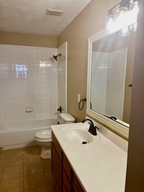 10826 Buffum St, Houston, TX 77051 - full bath featuring toilet, vanity, tile patterned floors, bathtub / shower combination, and a textured ceiling