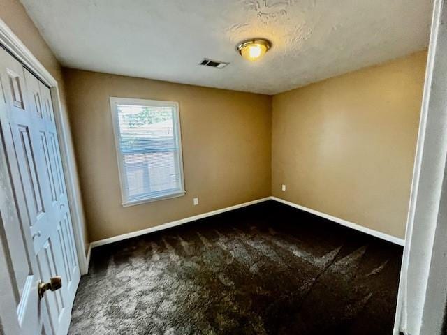 10826 Buffum St, Houston, TX 77051 - unfurnished bedroom with carpet flooring, baseboards, and a closet