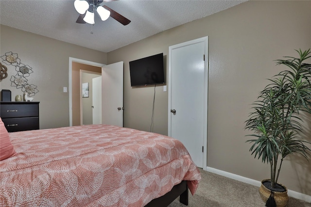 bedroom with carpet floors, baseboards, and a ceiling fan