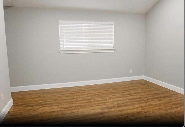 1703 Grand Valley Dr, Houston, TX 77090 - spare room with wood finished floors and baseboards