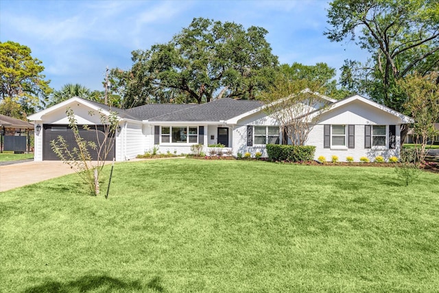 8932 Padfield St, Houston, TX 77055 - single story home with a garage, concrete driveway, and a front lawn
