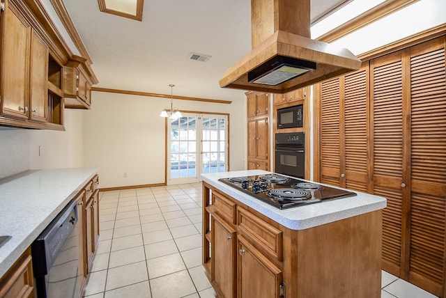 3807 Lamplighter Cir, Missouri City, TX 77459 - kitchen with black appliances, island range hood, light countertops, light tile patterned floors, and a kitchen island