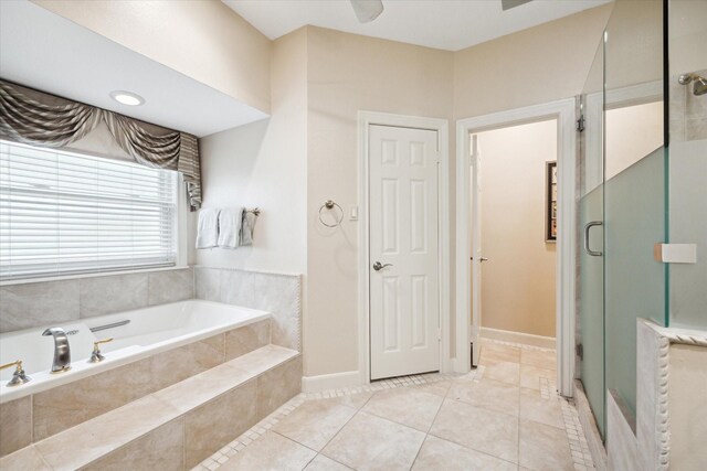 full bathroom with a stall shower, a garden tub, and tile patterned floors